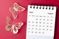 The August 2023 desk calendar for the organizer to plan and reminder with paer butterfly on red background