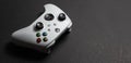 30 August, 2023 - Dnipro, Ukraine: White controller xbox Series S gamepad, game console on dark background Royalty Free Stock Photo