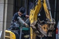 Worker sitting on a construction vehicle