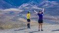 August 27, 2016 - Females mountain biking and stretching at Polychrome Pass, Denali National Park, Interior, Alaska cross country