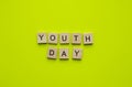 International Youth Day, minimalistic banner with the inscription in wooden letters
