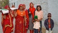 Indian women offer milk or sacred food by hand to the idol of the god. Hinduism and festival concept