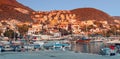 Excursion boats and yachts in marina port of popular fishing town of Kas at sunset time Royalty Free Stock Photo