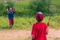 August 26, 2014 - Kids playing badminton in Sauraha, Nepal Royalty Free Stock Photo