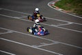 Kart racers compete for position on compitition
