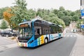 Comfortable electric hybrid public transport bus rides on the streets of Luxembourg city