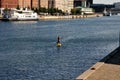 Male stand up paddle sail board in Copenhagen canal in capital