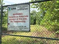 EPA warning sign on chain link fence of Crown Vantage Landfill Superfund Site