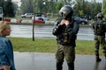 August 30 2020 Minsk Belarus Beautiful woman stands in front of armed police