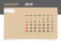 August 2019 - Monthly calendar on brown paper and wood background with area for note.