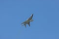 29 AUGUST 2019 MOSCOW, RUSSIA: A gray military fighter jet flying in the sky upside down Royalty Free Stock Photo