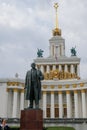 30 of August 2020 - Moscow, Russia: Lenin monument and main pavilion at All-Russian Exhibition Center Royalty Free Stock Photo