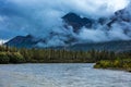 August 25, 2016 - Mountain, river and clouds view in Autumn, off Richardson Highway, Route 4, North of Paxon, Alaska Royalty Free Stock Photo