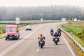 Group of bikers riding on mountain road