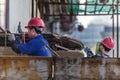 Worker who is polishing the surface of the board