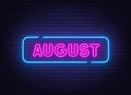 August neon neon sign on brick wall background.