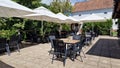 Outdoor terrace of Butoiul Sasului restaurant. Royalty Free Stock Photo