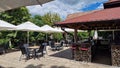 Outdoor terrace of Butoiul Sasului restaurant. Royalty Free Stock Photo