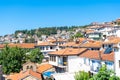 Red-tiled roofs of Ohrid. Beautiful city of North Macedonia known for amazing lake and UNESCO WHS. August 2019