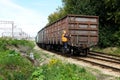 August 16, 2019 Russia, Podolsk. - The railway freight train makes a maneuver. Worker monitors movement