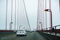 August 19, 2017, San Francisco/CA/USA - Driving on the Golden Gate bridge on a cold, foggy morning Royalty Free Stock Photo