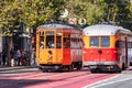 August 21, 2019 San Francisco / CA / USA - Old fashioned electric street cars passing on Market Street in downtown San Francisco Royalty Free Stock Photo