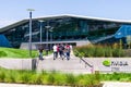 August 9, 2019 Santa Clara / CA / USA - People walking towards the entrance to Nvidia Endeavor office building at the Company`s