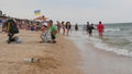 August 13, 2021 - Schastlivtsevo, Ukraine: Strong waves with foam on the shore of the Sea of Azov, Ukraine. People swim