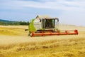 22 August 2021 Skutec, Czech Republic: Combine harvester harvests wheat close up. Wheat exports.