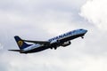 A Ryanair airplane takes off at Cork International Airport on a cloudy day