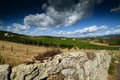 12 august 2017: stone wall and a beautiful vineyard on background with blue sky. Located near San Donato Village Florence