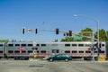 August 30, 2017 Sunnyvale/CA/USA - Caltrain crossing at a street junction near a residential neighborhood in south San Francisco Royalty Free Stock Photo