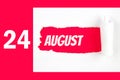 August 24th. Day 24 of month, Calendar date. Red Hole in the white paper with torn sides with calendar date. Summer month, day of