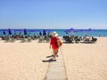 August 5th, 2018. People relaxing on sunbeds under umbrellas on the beautiful Skala beach of Kefalonia island, Ionian sea, Greece Royalty Free Stock Photo