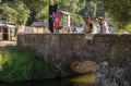 02 August 2019, Two beautiful girls fishing from a bridge in a medieval event `Viagem Medieval em Terra de Santa Maria`.