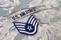 August 31, 2020. US AIR FORCE branch tape and Staff Sergeant rank patch and dog tags on digital tiger-stripe pattern Airman Battle