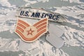 August 31, 2020. US AIR FORCE branch tape and Staff Sergeant rank patch and dog tags on digital tiger-stripe pattern Airman Battle