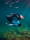 August 07, 2021. Varna, Bulgaria. Men freediver dive with fins in blue sea. Freediving underwater in transparent sea