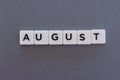 August word made of square letter word on grey background Royalty Free Stock Photo
