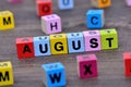 August word on table