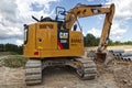 AT backhoe earth mover at a construction site back view