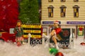 Coca Cola Holiday Vintage Village collection blurred lady on bench and little girl
