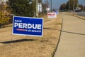 David Perdue Kelly Loeffler lawn election signs in on a lawn on Belair road