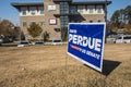 David Perdue senate election signs in on a lawn on Belair road 2021