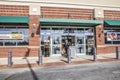 The Fresh Market retail grocery store entrance senior wearing a face mask