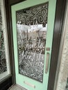 Green decorative door with glass window downtown Augusta