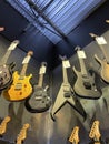Guitar Center retail store interior dark colored guitars in a corner