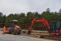 Heavy machinery on the side of the road at a construction site