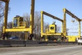 Huge Heavy industrial road machines and cranes on a bridge construction site cars pass