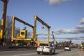 Huge Heavy industrial road machines and cranes on a bridge construction site right copy space